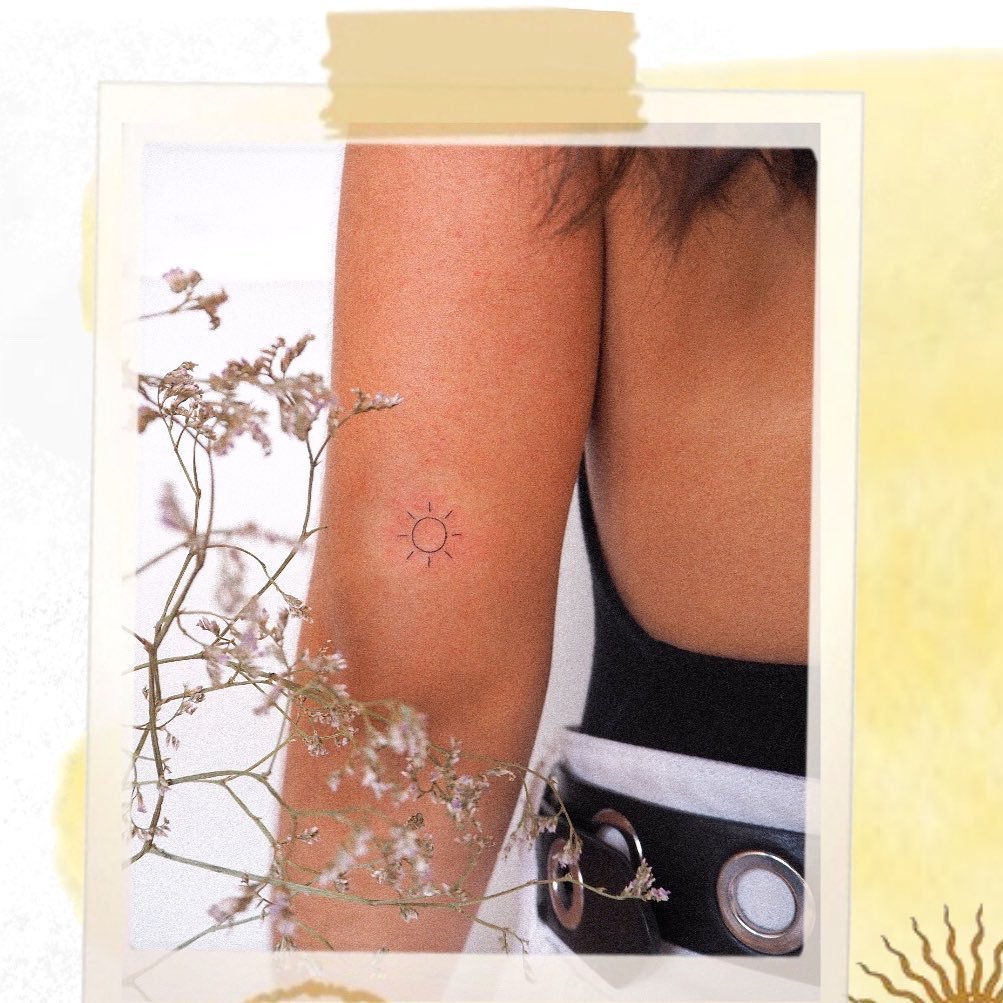Tatuaje de sol en pierna, línea fina Sinkply Madrid