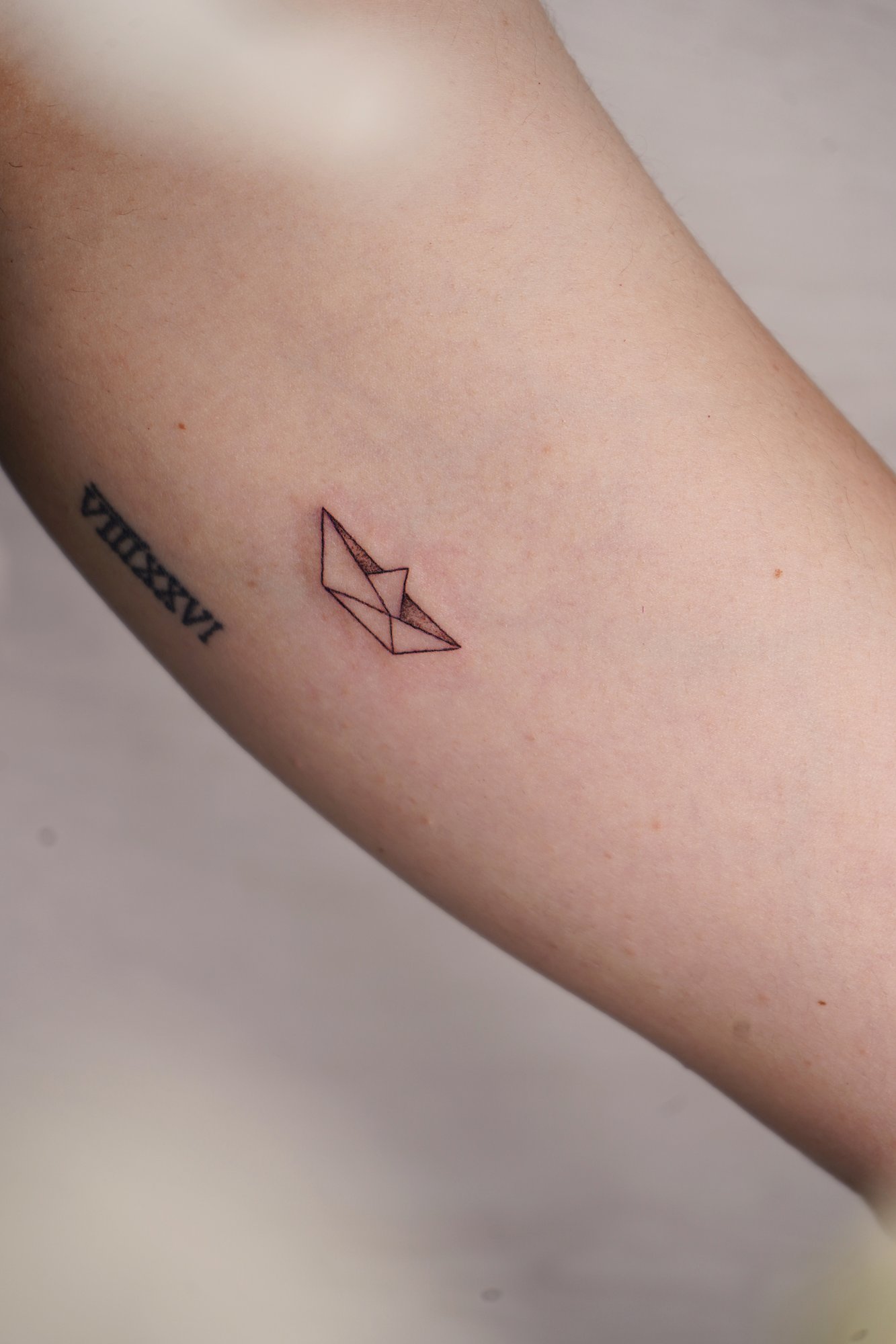 Tatuaje de frase ingles en zona desconocida, línea fina